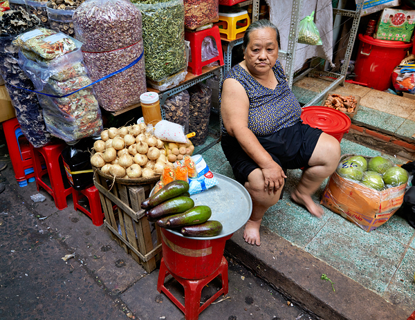 Fruit vendor sells fresh produce in Ho Chi Minh City Print