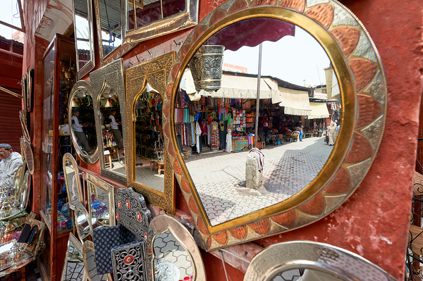 Life in the souk of Marrakesh showing local shops and items Print