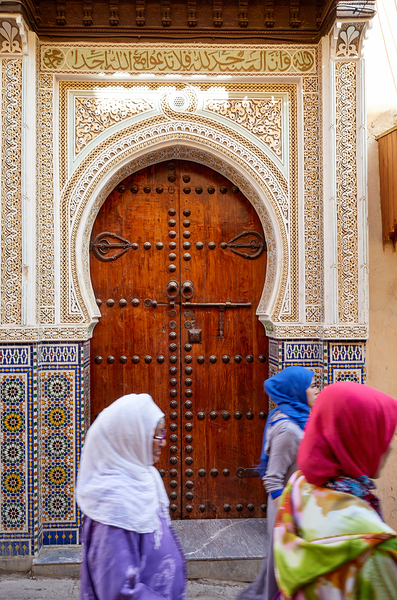 Women walk through the Medina in Fez Morocco by Marco Brivio