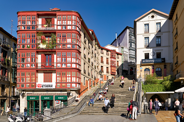 Stairs and buildings in downtown Bilbao Spain during the day Print