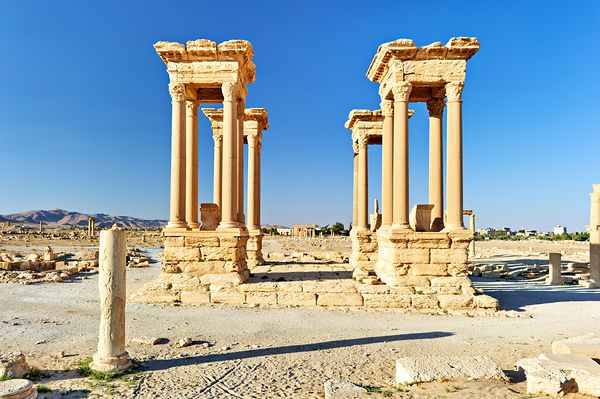 Exploring the Tetrapylon at Palmyra in Syria during the day Print