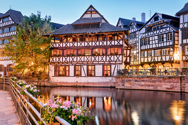 Timber houses in Petit France district by the water in Strasbour Print