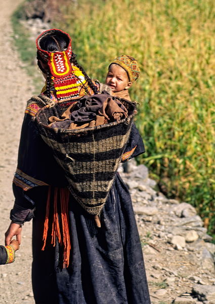 Life in kalash village of bumburet valley with a child Print