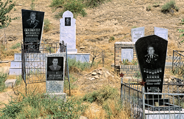 Cemetery in Samarkand shows different tombstones and graves Print