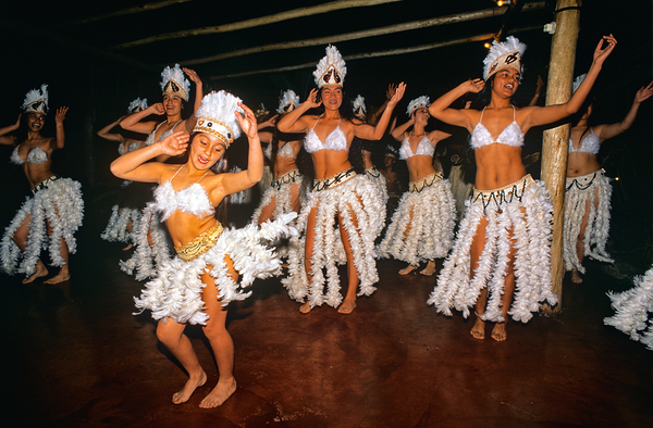 Women perform traditional dance in feathered costumes on Easter  by Marco Brivio
