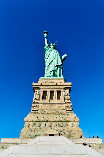 Statue of Liberty stands proudly on Liberty Island in Manhattan by Marco Brivio