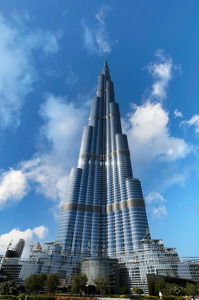 Burj Khalifa stands tall against a blue sky in Dubai UAE Print