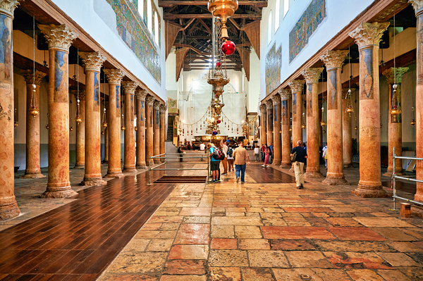 Visitors explore the Church of the Nativity in Bethlehem by Marco Brivio