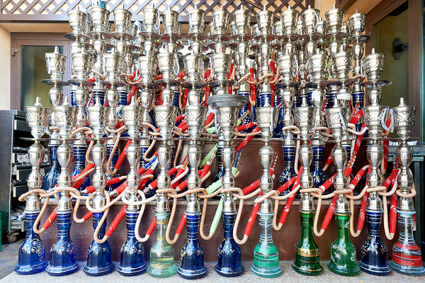 Display of hookahs for sale in Dubai cafe with many options Print