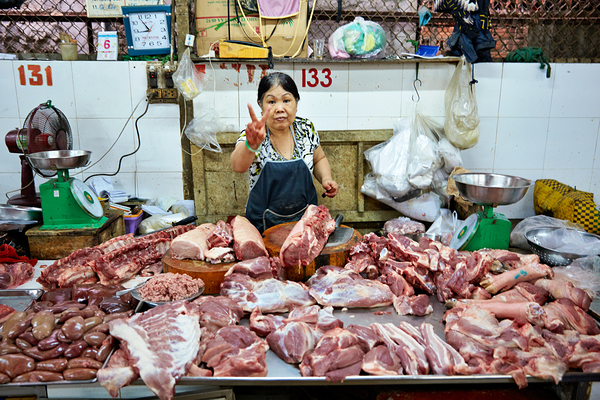 Market scene in Ho Chi Minh City with meat vendor Digital Download