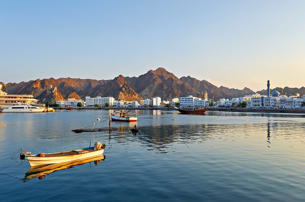 Waterfront view in Muscat Oman at sunset near boats Print