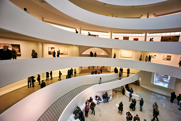 People walk through the spiraled structure of Solomon R Print