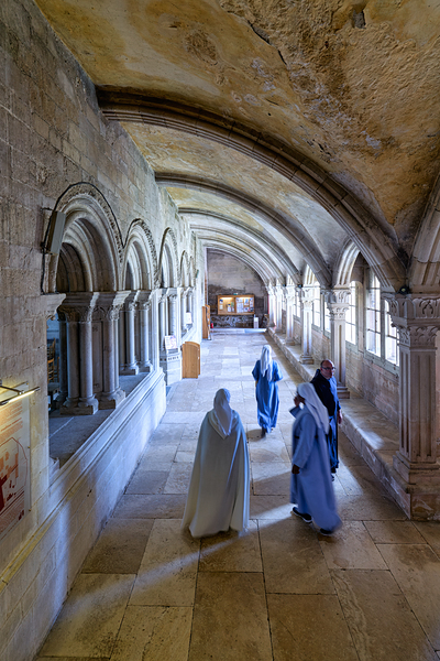 Nuns walk in the cloister of Vezelay Abbey in Bourgogne France Print