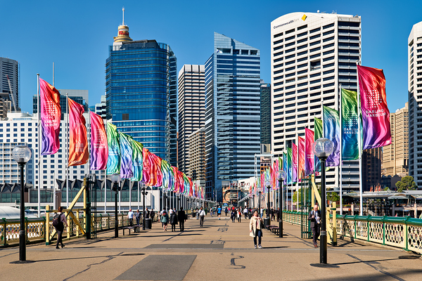 Colorful flags line bridge in Darling Harbour Sydney on a sunny  Print