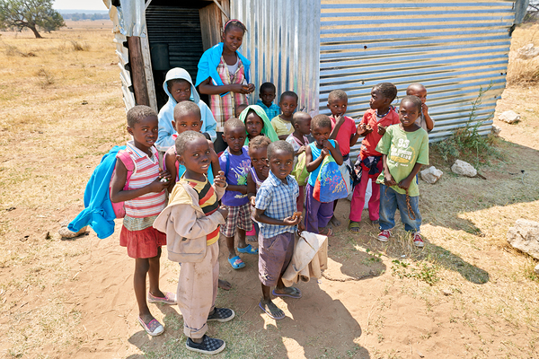 Students gather outside a school in Kavango Region Namibia Print