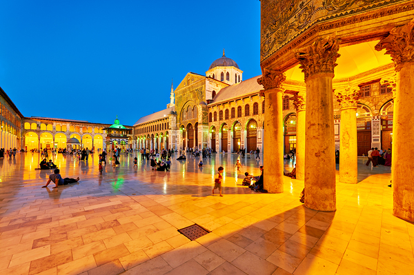 Visitors enjoy evening time at Umayyad Mosque in Damascus Syria Print