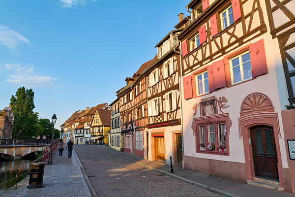 People walking along the canal in Petite Venise Colmar during ev Print