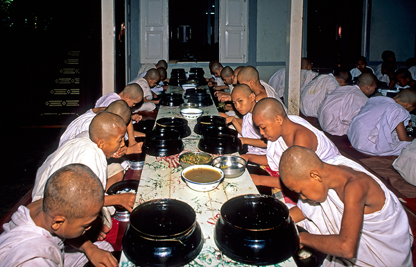 Monks having lunch in Mandalay during the day Print