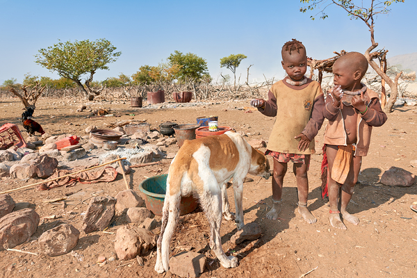 Children playing near their home in Himba Village in Namibia Print