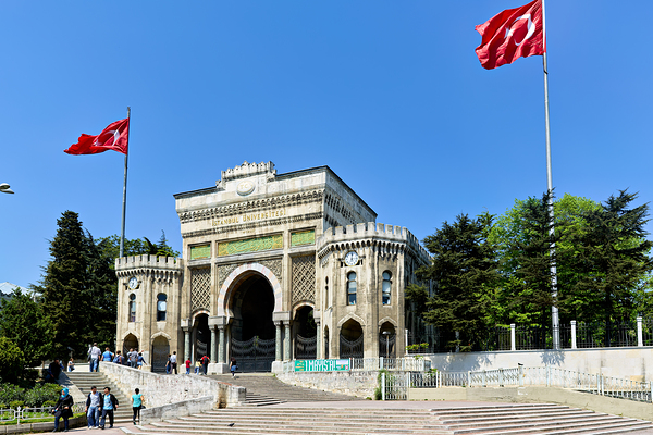 Historic university building in Istanbul Turkey with flags Print