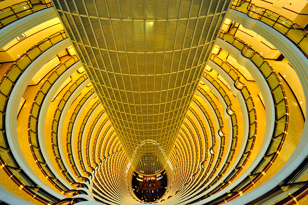 Golden hotel atrium with glass elevator in Shanghai China Print