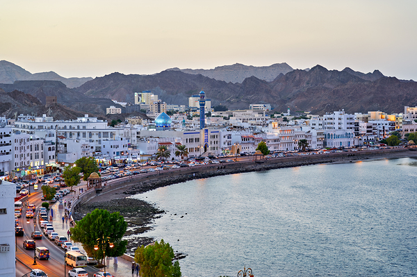 Waterfront cityscape view of Muscat Oman at dusk Print