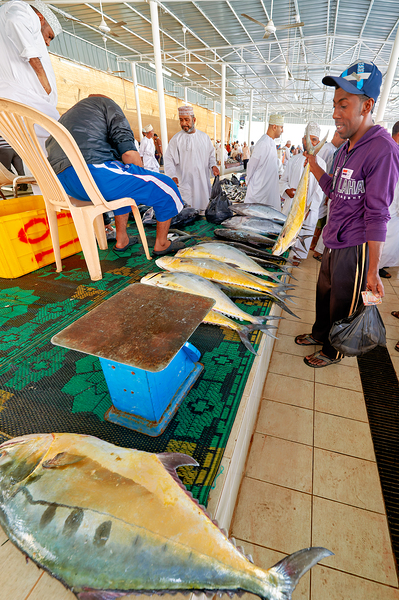 Fish market in Muscat Oman shows local vendors and buyers by Marco Brivio