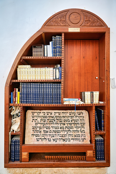 Bookshelf with religious texts in Sephardic synagogues in Jerusa Print