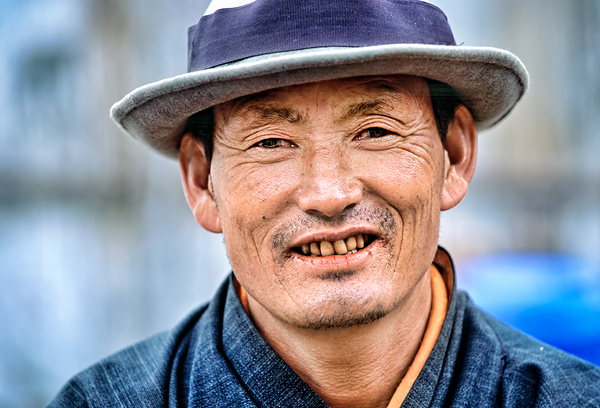 Portrait of a smiling man wearing a hat. Print