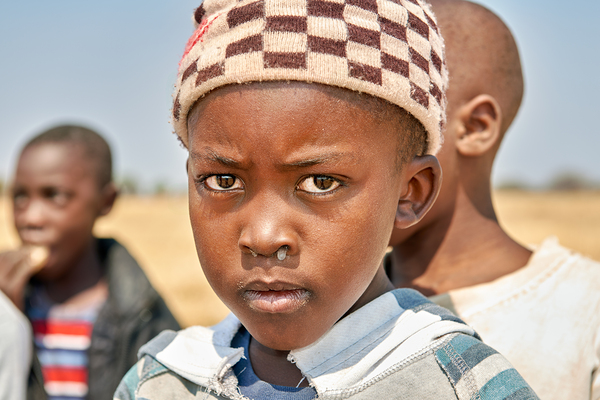 Portrait of a boy in Kavango Region Namibia during the day Print