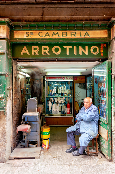 Grinder street shop in Palermo Sicily with shopkeeper Print