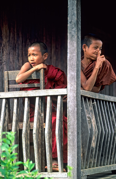 Monks sitting on balcony in Kalaw village Myanmar Print