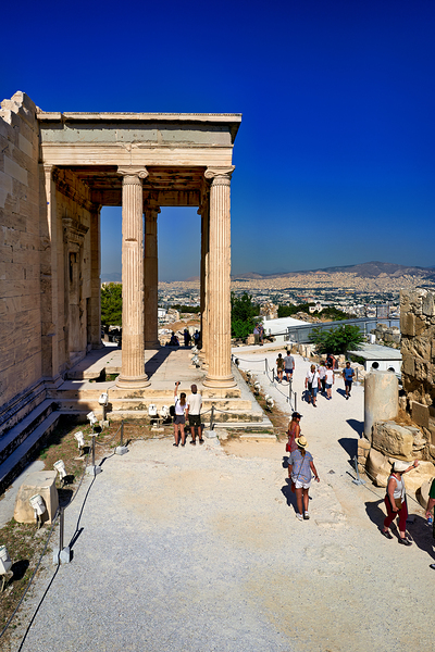 Erechtheion temple in Athens Greece shows visitors and ancient c by Marco Brivio