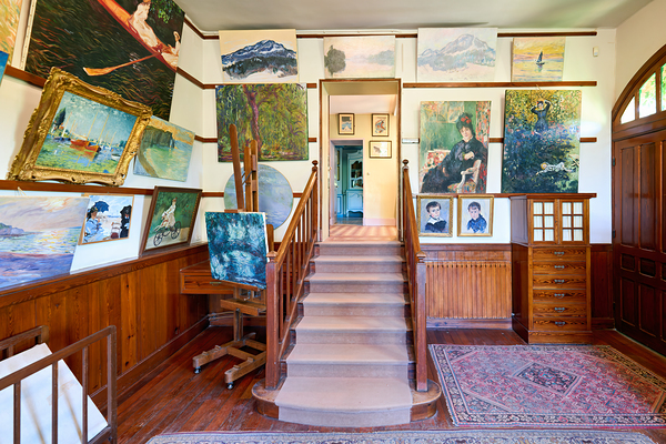 Visitors enjoy Monets house and paintings in Giverny Normandy F by Marco Brivio