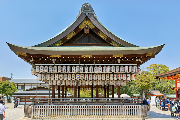 Visitors admire Yasaka shrine in Kyoto during sunny day Print