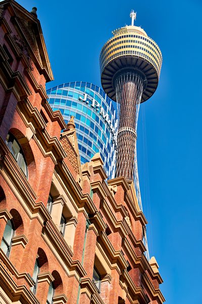 Sydney Tower and J.P. Morgan building against blue sky. Print