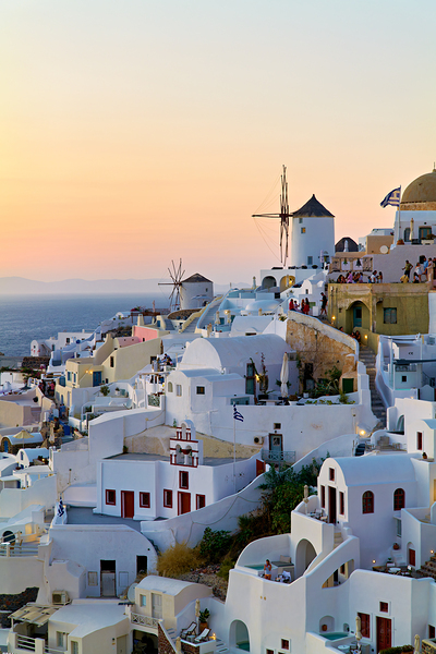 Oia Santorini: White buildings windmills and sunset over the  Print