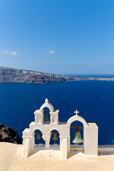 Santorini bell tower overlooking the Aegean Sea. Print
