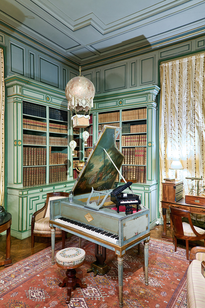 Chateau de Cheverny interior with piano and bookshelves Print