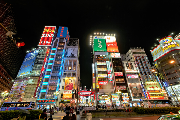Neon lights shine bright in Shinjuku district of Tokyo at night Print