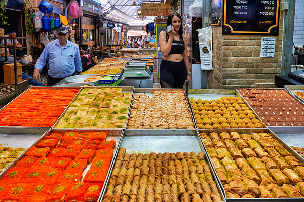 Visitors explore food stands at Mahane Yehuda Market in Jerusale Print