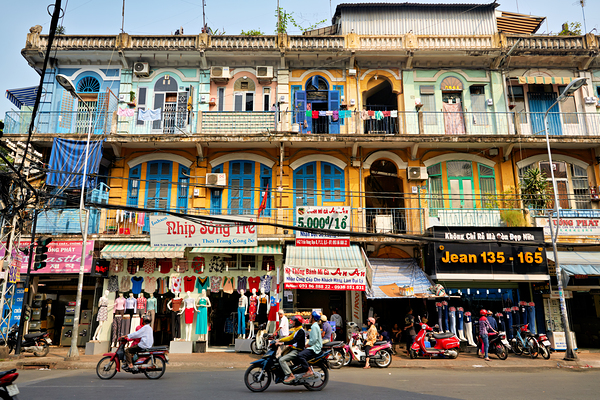 Shopping in Ho Chi Minh City streets during a sunny day Print