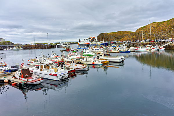 Fishing boats docked in Stykkisholmur harbor in Iceland by Marco Brivio