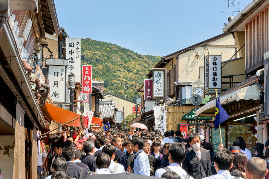 Crowds explore the Higashiyama district in Kyoto Japan on a sun  Print