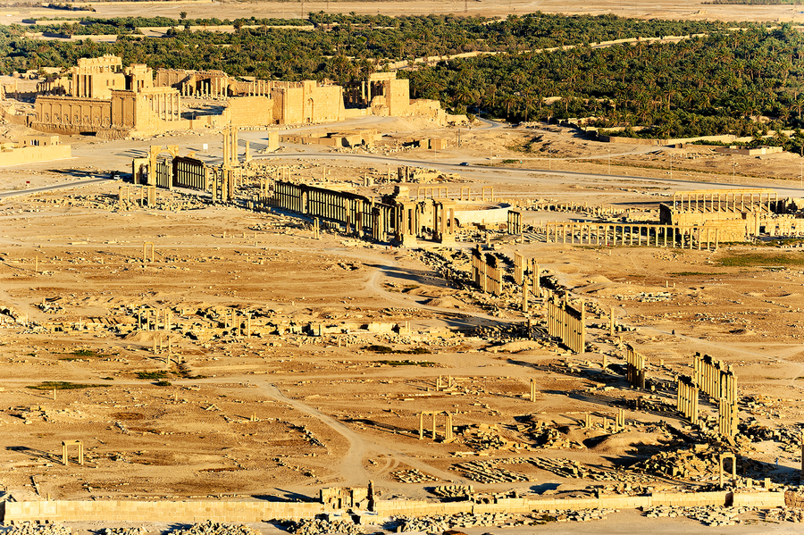 Aerial view of Palmyra ancient city in Syria reveals ruins and h  Print