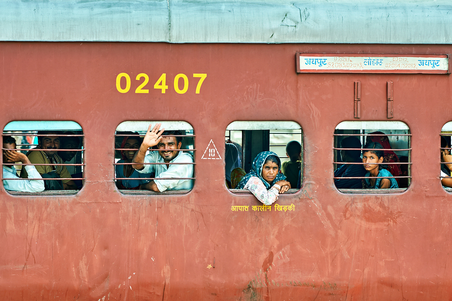 People travel on a train in Rajasthan India during the day  Print
