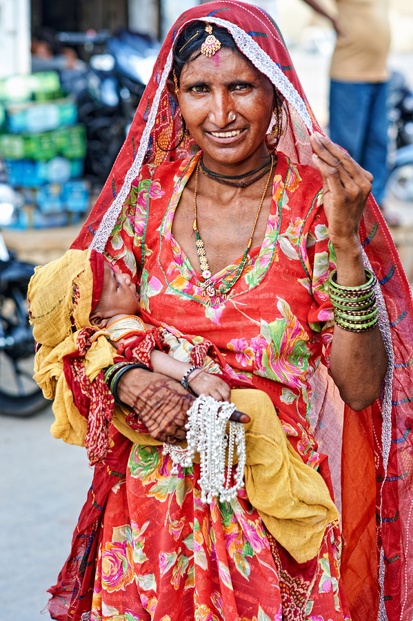 Woman with baby in Jaisalmer Rajasthan marketplace  Print