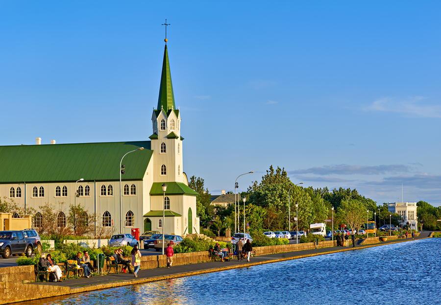 Lutheran free church by lake tjornin in reykjavik iceland  Print