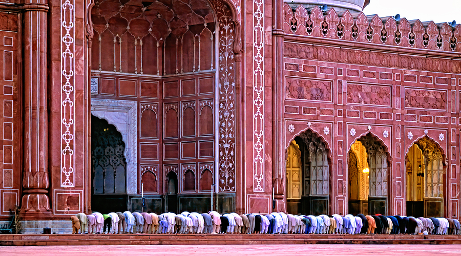 Prayer time at Badshahi Mosque in Lahore Pakistan  Print