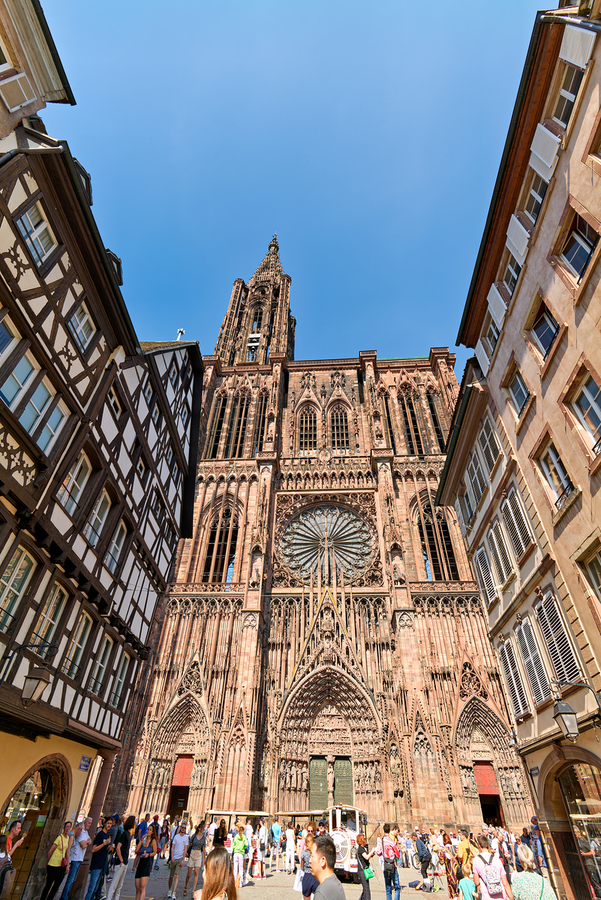 Tourists gather at Strasbourg Cathedral in Alsace on a sunny day  Print